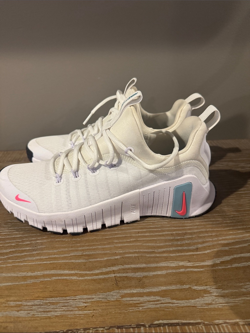 Nike womens White Sneakers with Pink Swoosh and Teal Accent